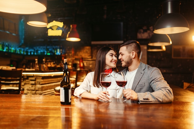 Romantic evening, couple in bar, date celebration