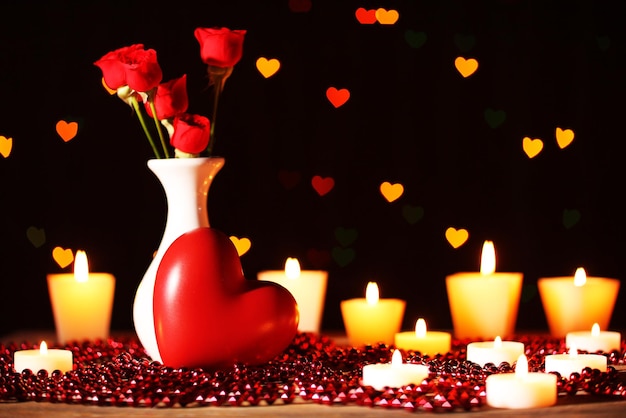 Romantic gift with candles on lights background, love concept