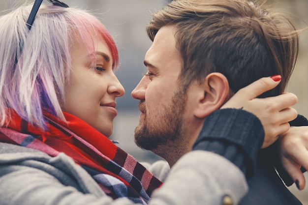 Romantic happy couple face to face close up portrait, smiling man and woman in love getting closer for first kiss, sensual sincere lovers touching noses with eyes closed, enjoying intimacy tenderness