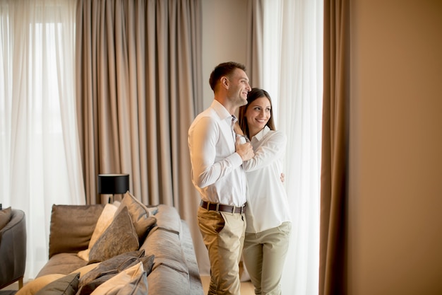 Romantic happy young couple relax at modern home interior