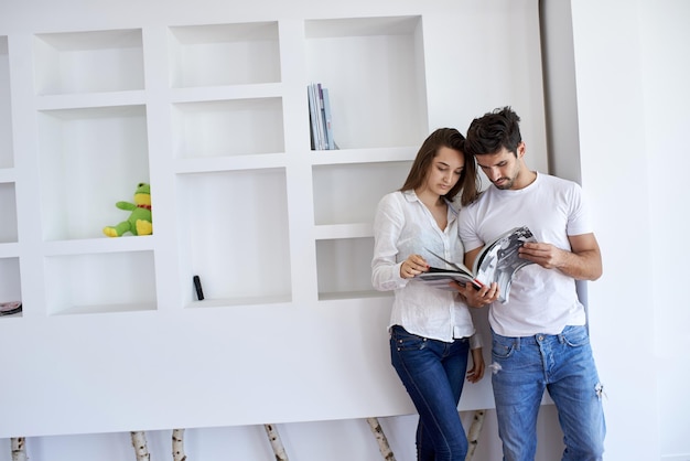 romantic happy young couple relax at modern home staircase indoors