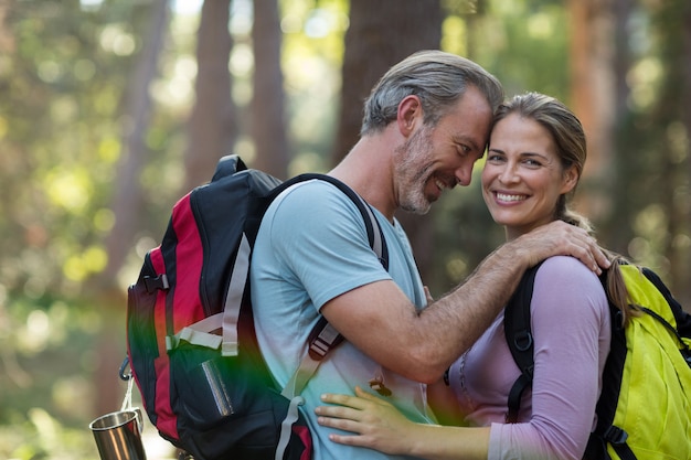 Romantic hiker couple embracing each other