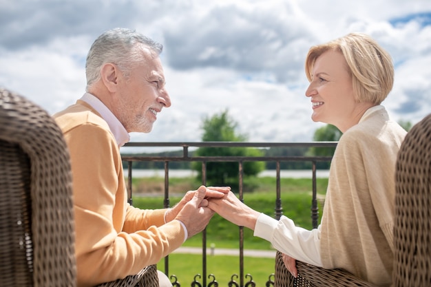 Romantic husband and his wife enjoying each others company outdoors