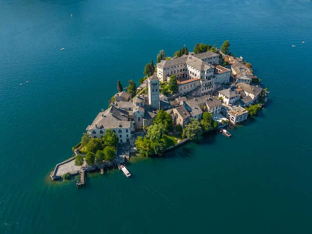 Romantic island of San Giulio in Orta lake Piedmont Italy Aerial view