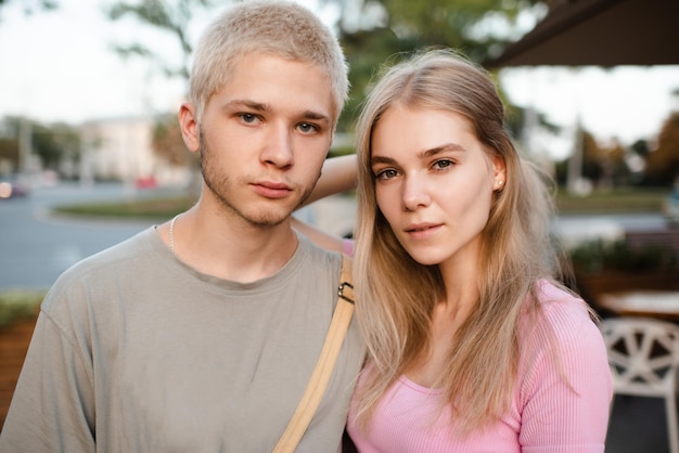 Romantic love couple of teenage girl and boy 17-18 year old together outdoor Happy teenagers smiling