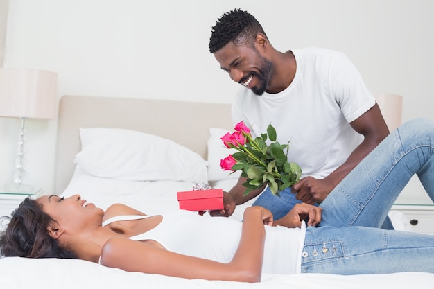 Romantic man giving roses to partner