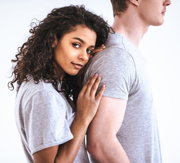 The romantic man and a woman standing on the white background