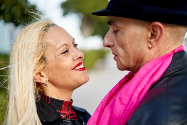 Romantic middleaged couple embracing the port