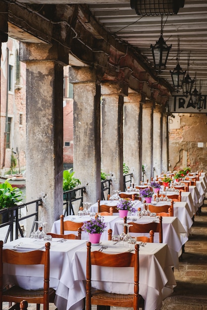 Romantic outdoor restaurant in Venice. Wine and coffe restaurant in Venezia.