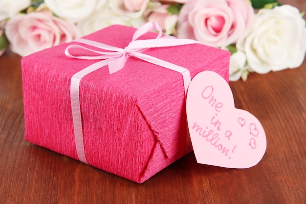 Romantic parcel on wooden background