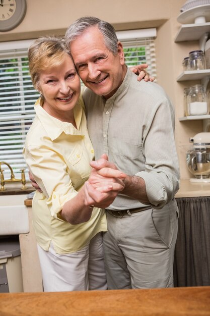 Romantic senior couple dancing together 