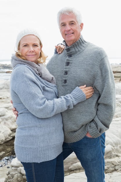 Romantic senior couple on rocky beach