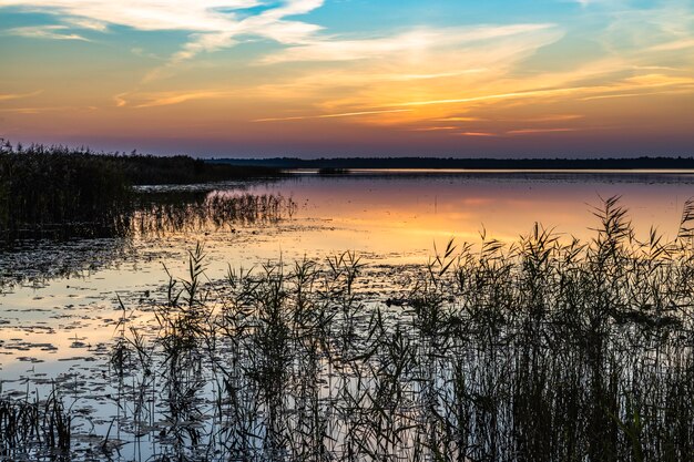 Romantic Sunset Glowing Twilight Over the Lake.