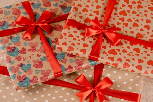 Romantic valentine day gift box for couple in love with heart ornament and red bow and silk ribbon