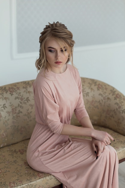 Romantic woman in a pink vintage dress