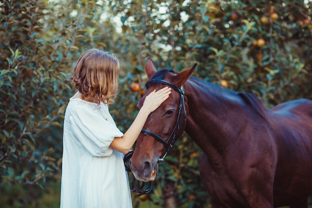 Romantic woman portrait with the horse. Dreaming with best friend