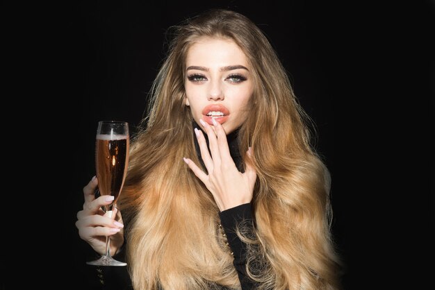 Romantic woman with long hair professional makeup sensual lips hold glass of champagne sexy woman