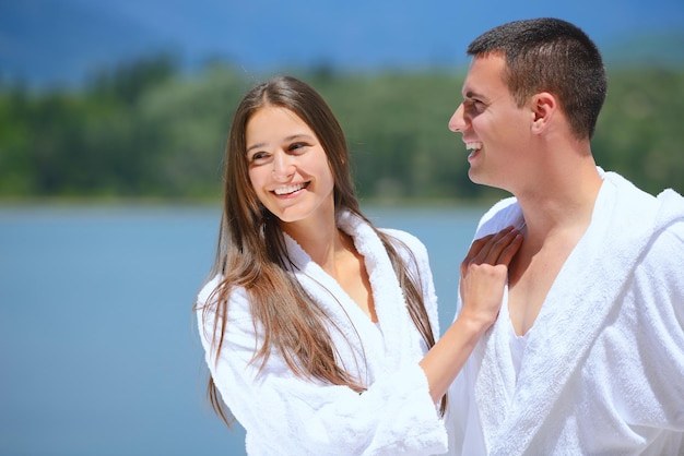 Romantic young couple spending time together and relaxing on yacht