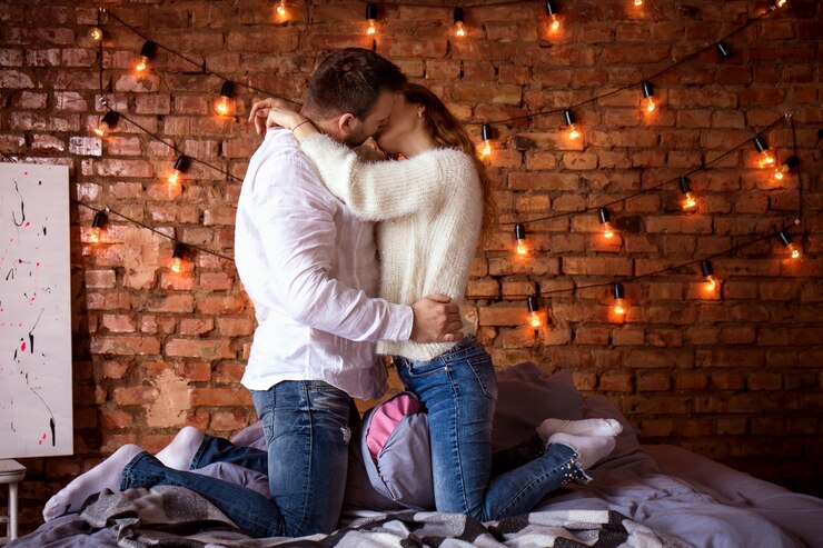 Foto romantisch paar in bed tegen een bakstenen muur
