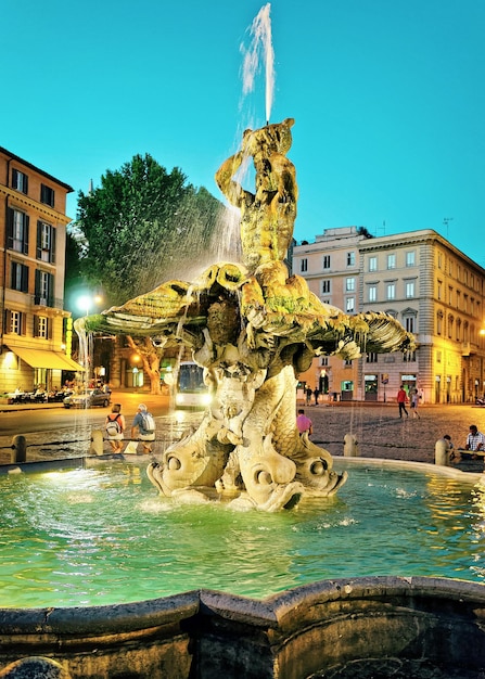 Rome, Italy - August 27, 2012: Ancient Fountain in the City Center of Rome of Italy. In the evening. Specially toned in vintage style