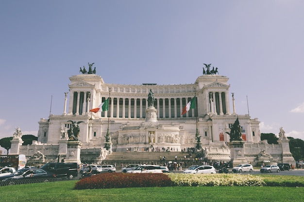 Rome, Italy - July 3, 2018: : Panoramic front view of museum the Vittorio Emanuele II Monument also known as the Vittoriano or Altare della Patria at Piazza Venezia in Rome. Summer day and blue sky