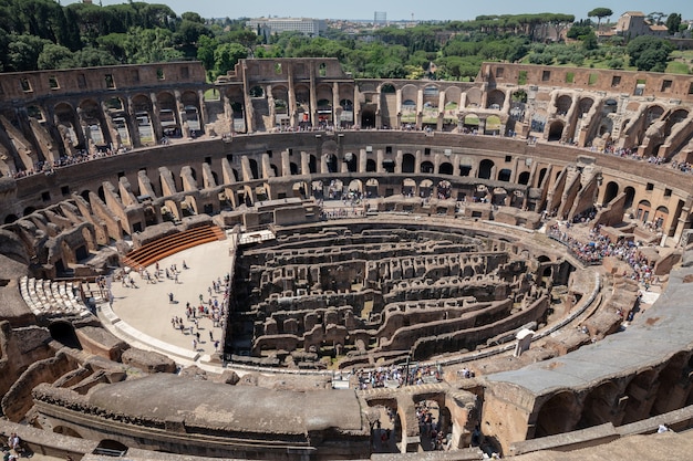 Rome, Italy - June 20, 2018: Panoramic view of interior of Colosseum in Rome. Summer day with blue and sunny sky