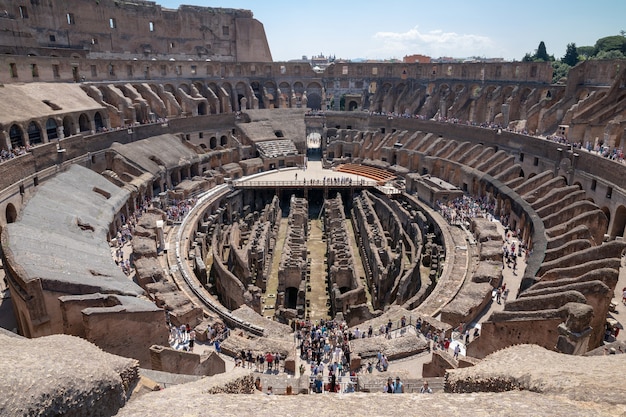 Rome, Italy - June 20, 2018: Panoramic view of interior of Colosseum in Rome. Summer day with blue and sunny sky