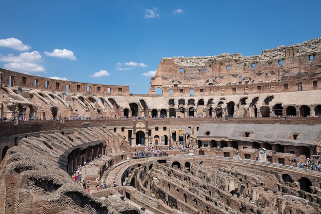 Rome, Italy - June 20, 2018: Panoramic view of interior of Colosseum in Rome. Summer day with blue and sunny sky