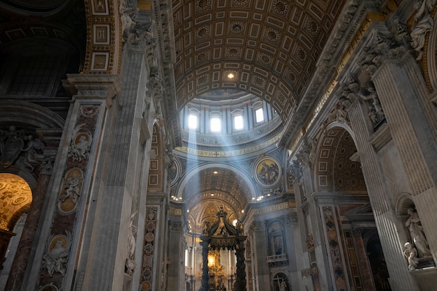 Rome, Italy - June 22, 2018: Panoramic view of interior of Papal Basilica of St. Peter (St. Peter's Basilica). It is an Italian Renaissance church in Vatican City, papal enclave within city of Rome