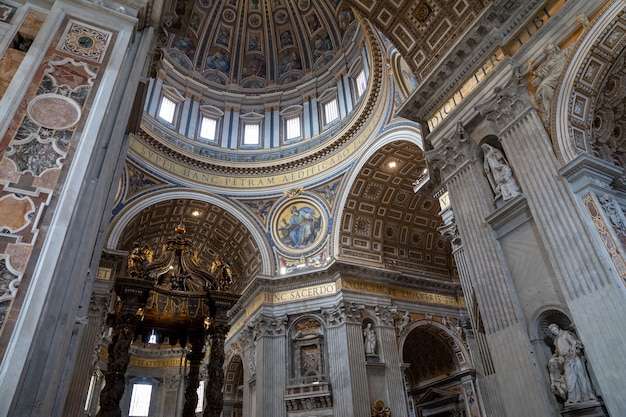 Rome, Italy - June 22, 2018: Panoramic view of interior of Papal Basilica of St. Peter (St. Peter's Basilica). It is an Italian Renaissance church in Vatican City, papal enclave within city of Rome