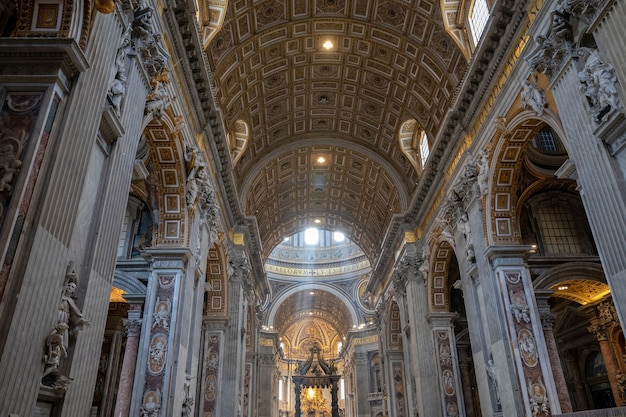 Rome, Italy - June 22, 2018: Panoramic view of interior of Papal Basilica of St. Peter (St. Peter's Basilica). It is an Italian Renaissance church in Vatican City, papal enclave within city of Rome