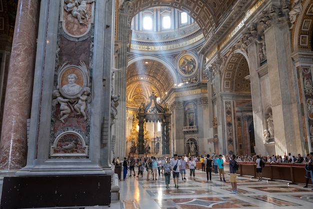 Rome, Italy - June 22, 2018: Panoramic view of interior of Papal Basilica of St. Peter (St. Peter's Basilica). It is an Italian Renaissance church in Vatican City, papal enclave within city of Rome