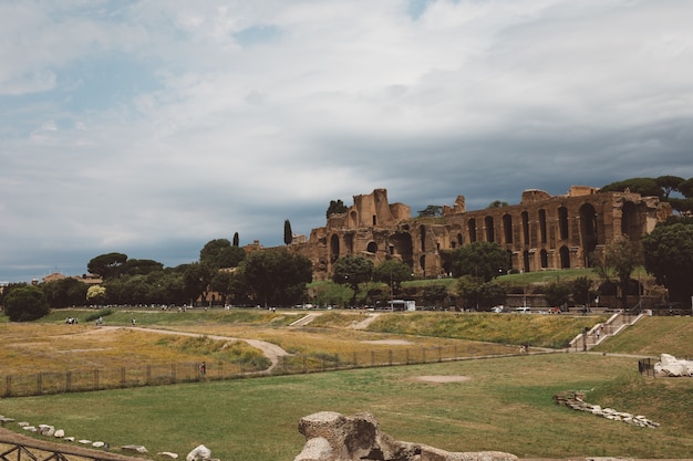 Rome, Italy - June 23, 2018: Panoramic view of temple of Apollo Palatinus on Palatine Hill of ancient Rome and Circus Maximus (Circo Massimo) is an ancient Roman racing stadium and mass entertainment