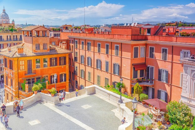 ROME ITALY MAY 08 2017 Beautiful landscape historical view of the Rome street people tourists on it Spanish Sqare Piazza di Spagna and descent from the Spanish Stairs Italy