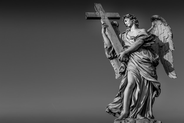 Rome, statue of an angel on the bridge in front of Castel Sant'Angelo. Conceptual useful for spirituality, christianity and faith.