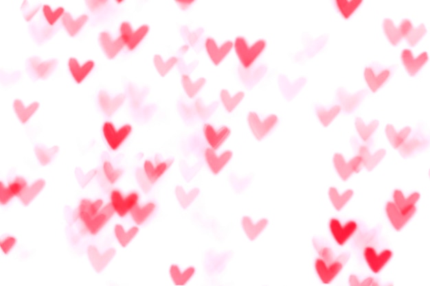 Rood hart valentijn bokeh lichten tegen een witte achtergrond