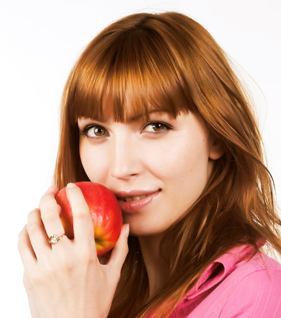 Roodharig meisje met appel