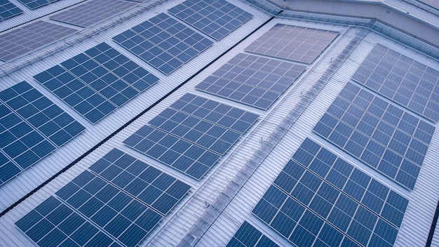 A roof of a building with solar panels on the roof.