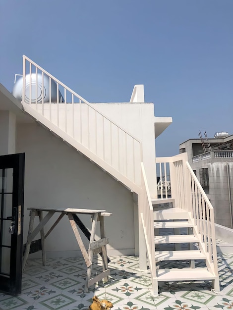 The roof of a house with a blue sky in the background