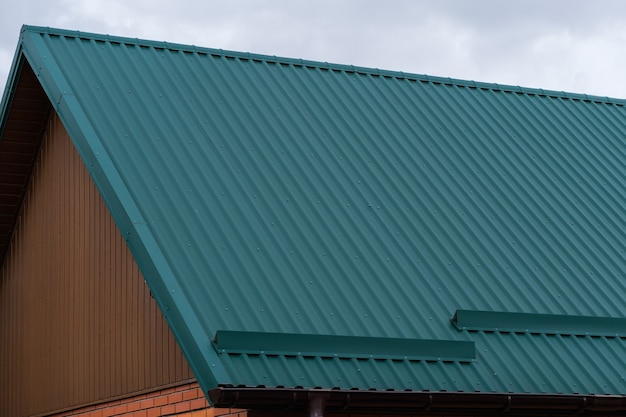 Roof made of green corrugated board with snow retainers