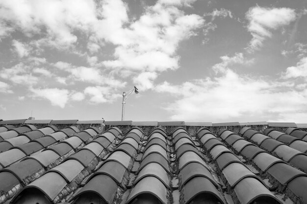 Roof with terracotta tile in miami usa Tile roofing on cloudy blue sky Architecture and design Rooftop with ceramic cover of classic clay material Protection and shelter concept