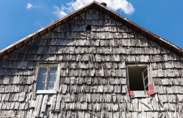 The roof of the wooden tile of the old rural house