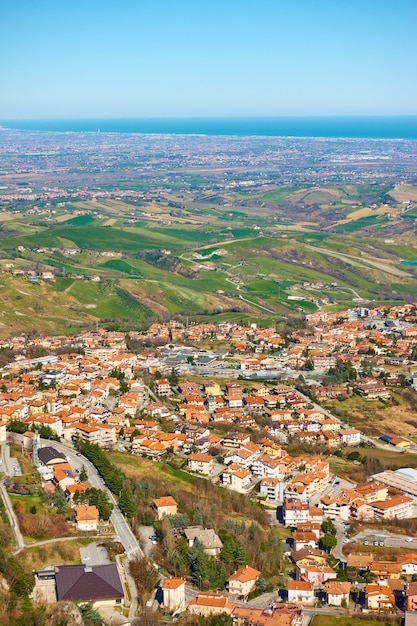 Roofs of Borgo Maggiore in San Marino and valley of Emilia-Romagna in Italy