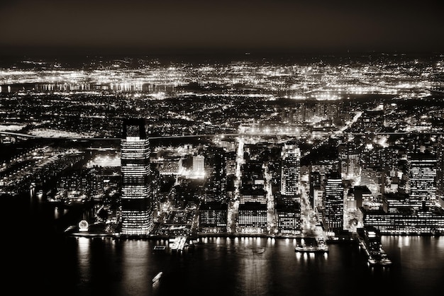 Rooftop night view of New Jersey from Manhattan downtown with urban skyscrapers