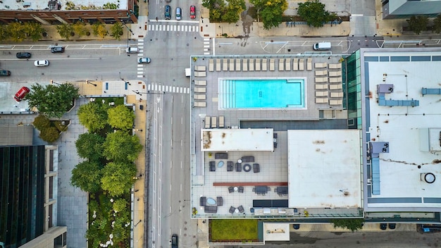 Rooftop pool aerial of Chicago on summer day in city with buildings from above tourism