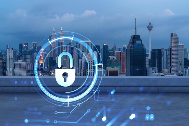 Rooftop with concrete terrace Kuala Lumpur night skyline Cyber security concept to protect clients confidential information IT hologram padlock icons City downtown Double exposure