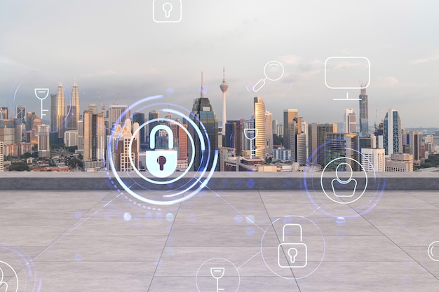 Rooftop with concrete terrace kuala lumpur sunset skyline cyber
security concept to protect clients confidential information it
hologram padlock icons city downtown double exposure