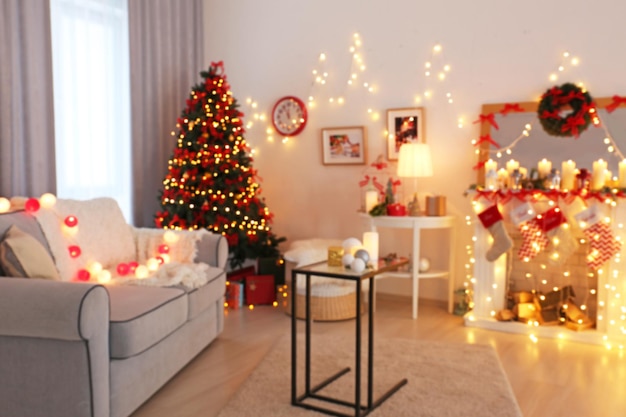 Room decorated for Christmas and beautiful fir tree, blurred view