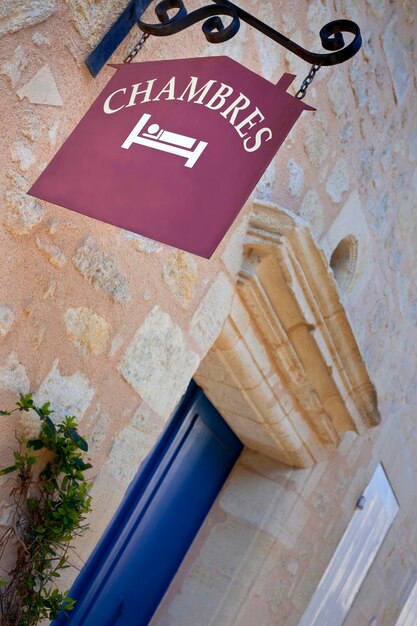 Room sign and blue wooden door