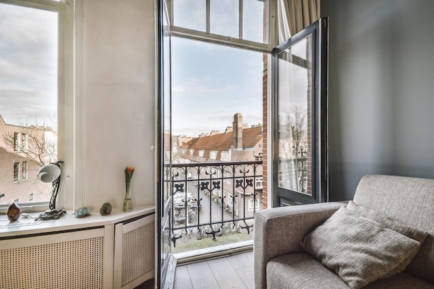 Room with balcony sofa door and window